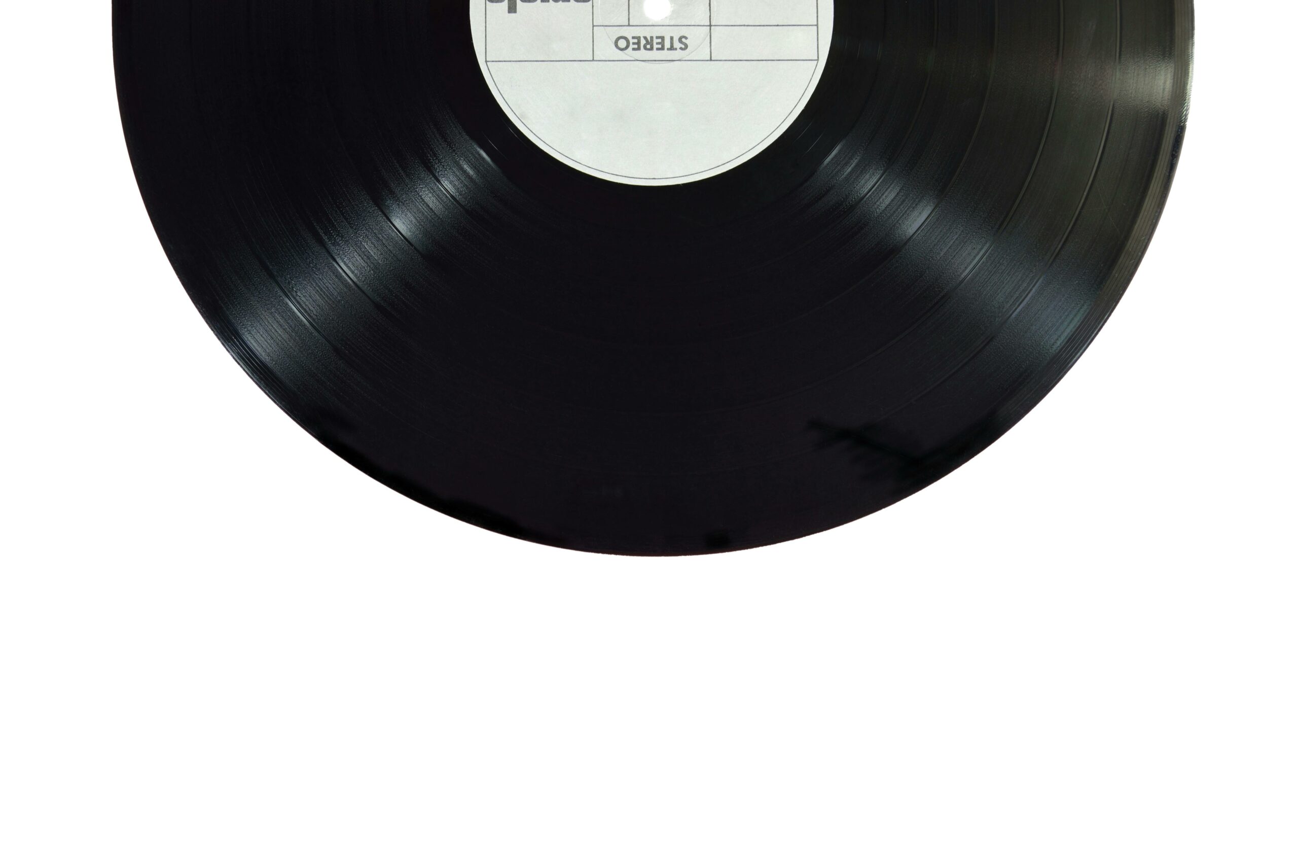 pexels-photo-167092-167092 A classic black vinyl record isolated on a white background.